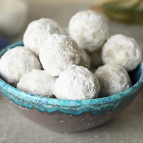 a bowl of snowball cookies