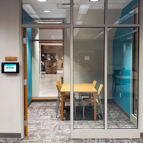 small room with table and chairs