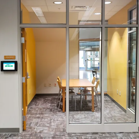 small room with table and chairs