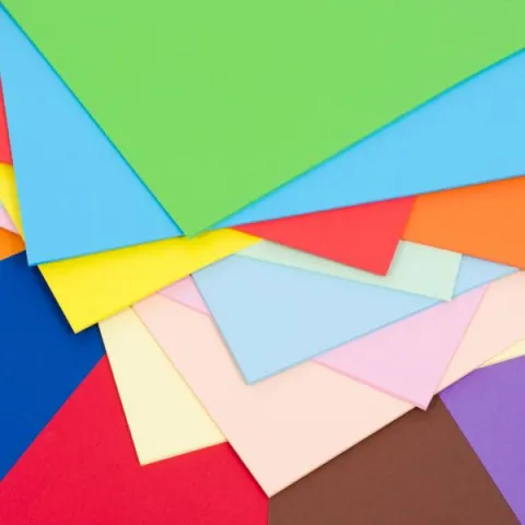 Stack of multi-colored sheets of paper.