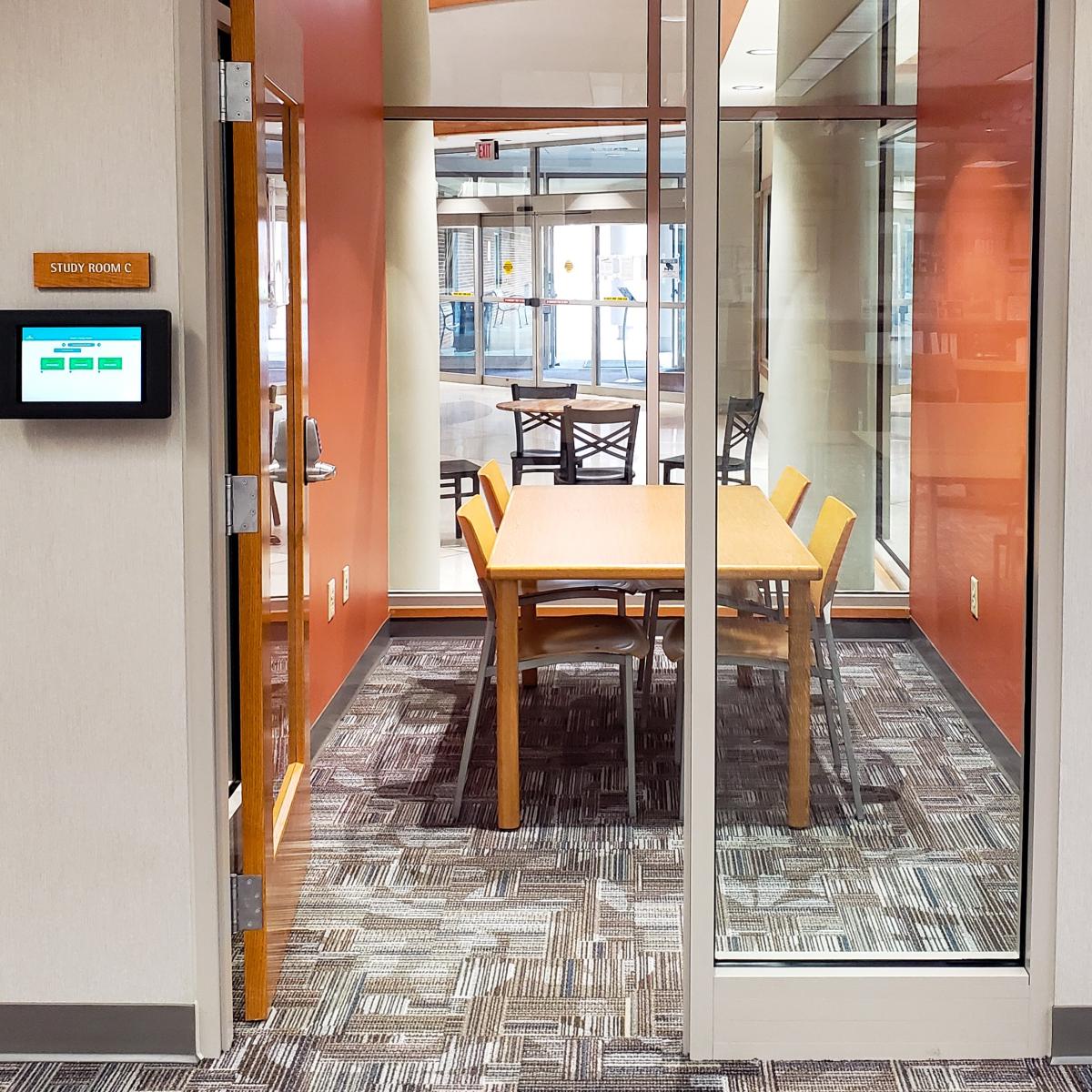 small room with table and chairs