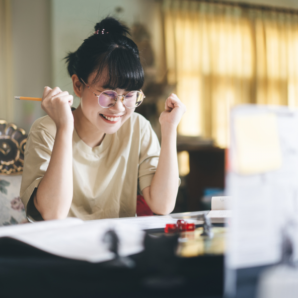 Young woman playing roleplaying game with her hands up.